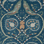 Decorative wallpaper pattern with floral elements on a blue background