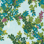 Pattern of green leaves and purple flowers on a light blue background