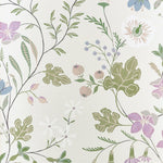 A botanical floral pattern wallpaper featuring green leaves, purple and white flowers, and small berries on a warm off-white background.