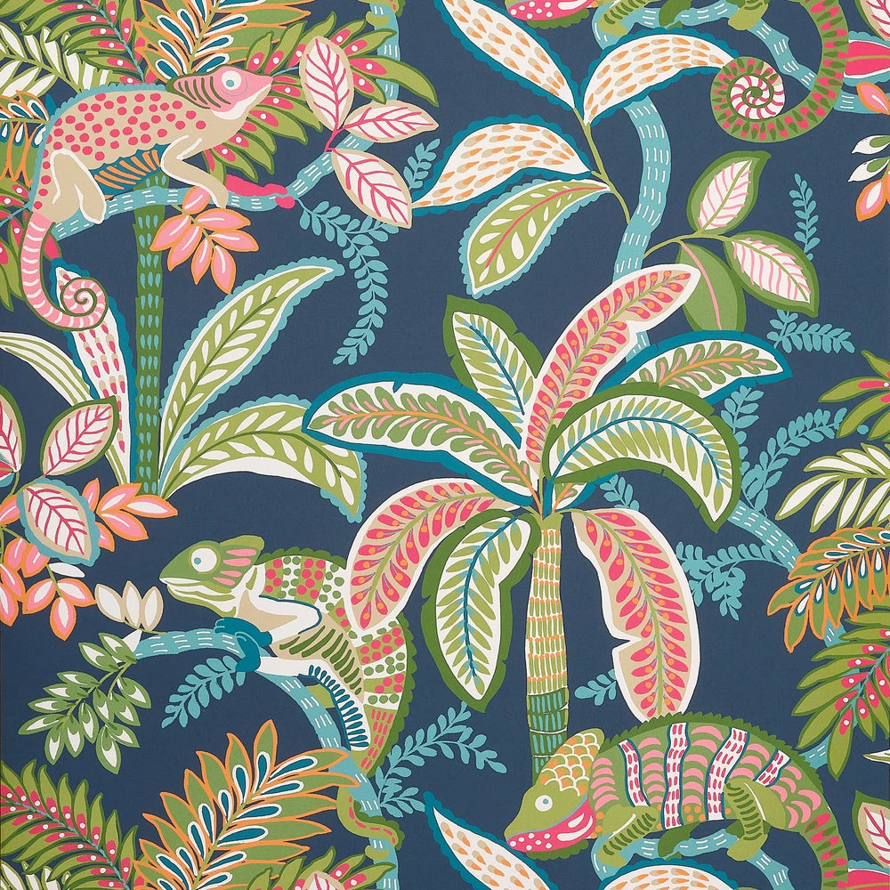 Tropical pattern with palm trees, chameleons, and flowers on a dark blue wallpaper