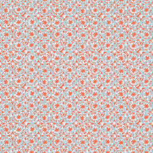 Patterned wallpaper with coral and blue sand dollars on a light blue background