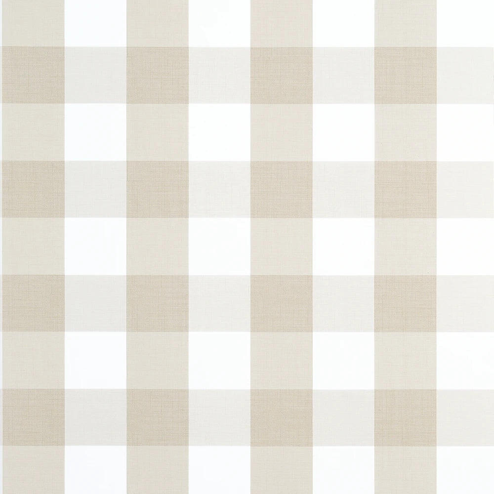 A close-up of a gingham check pattern in warm beige and white