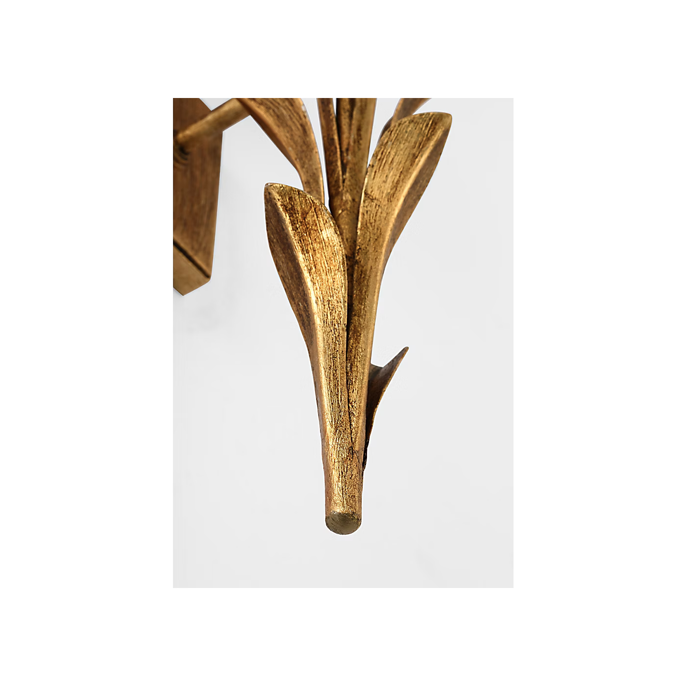 Gold leaf decorative item on a white background