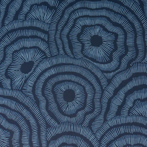 Blue patterned wallpaper with concentric circle design on a white background