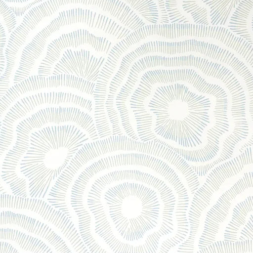 White patterned paper with circular designs on a white background