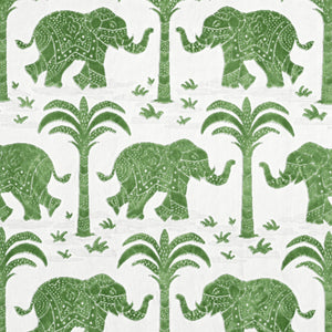 Pattern of green elephants and trees on a white fabric 