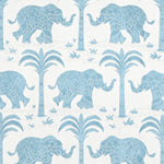 Pattern of blue elephants and palm trees on a white background