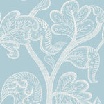 Light blue wallpaper featuring a delicate white botanical pattern of stylized leaves and branches with dotted and dashed line details.