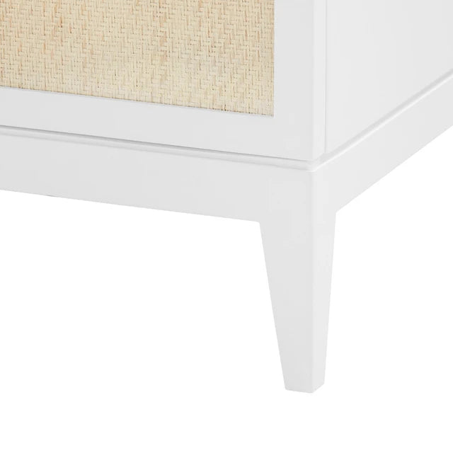 Close-up of a white dresser leg with a woven top on a white background