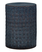 Decorative cylindrical stool with a blue patterned floral design on a white background