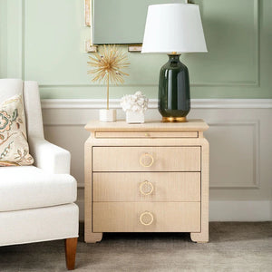 raffia wrapped side table against a wall and next to a white side chair 