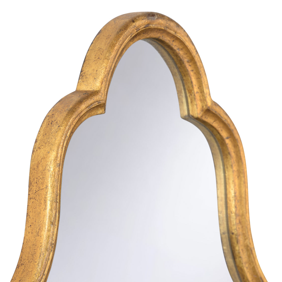 Close-up of a decorative wall mirror with a curved, scalloped frame in a distressed gold finish, set against a plain white background.