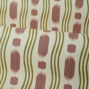 wallpaper with a pattern of red and green shapes on a beige background