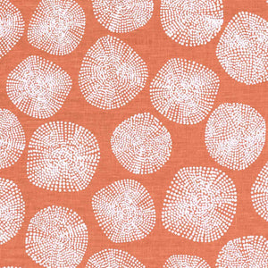 Pattern of white circles on a coral background